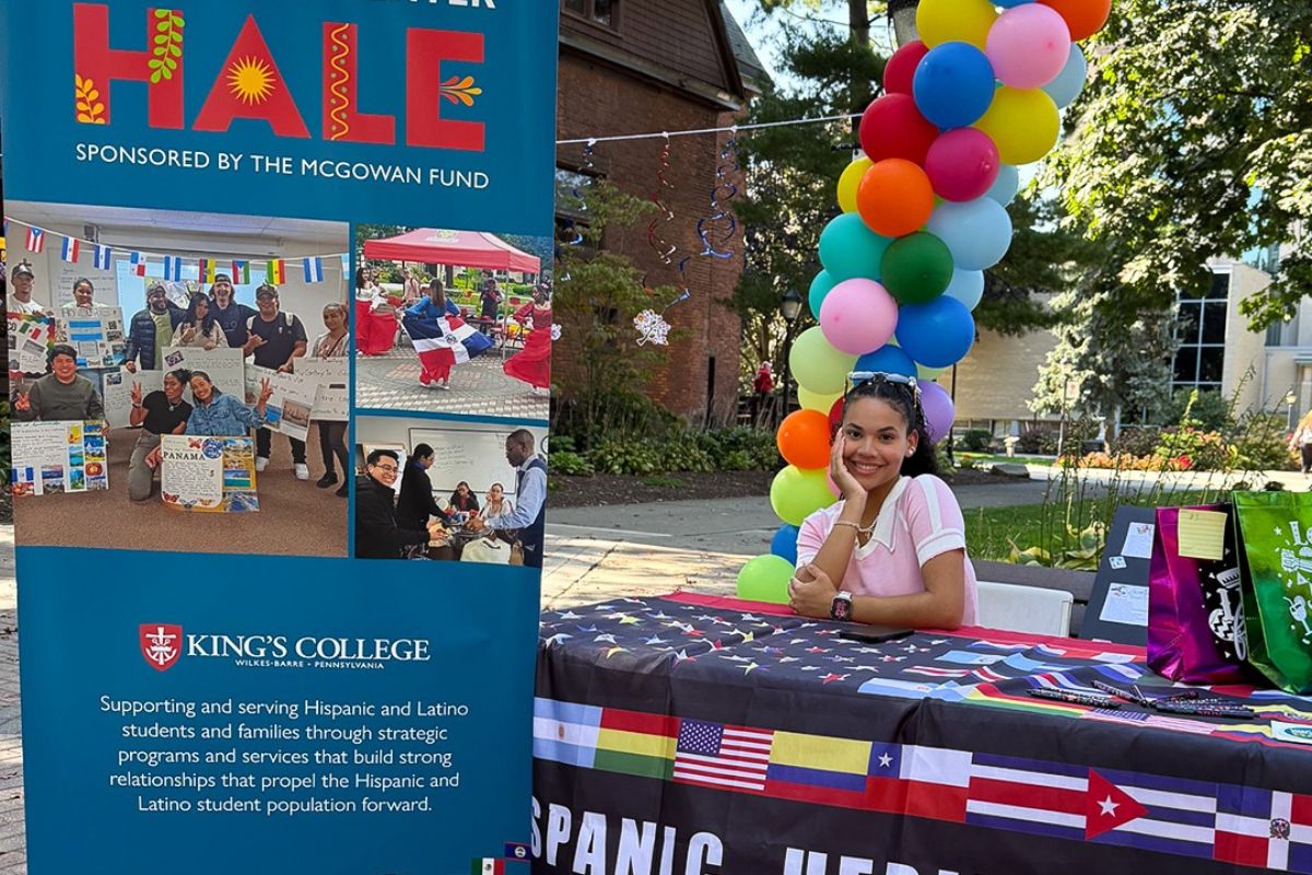 volunteer at the event table