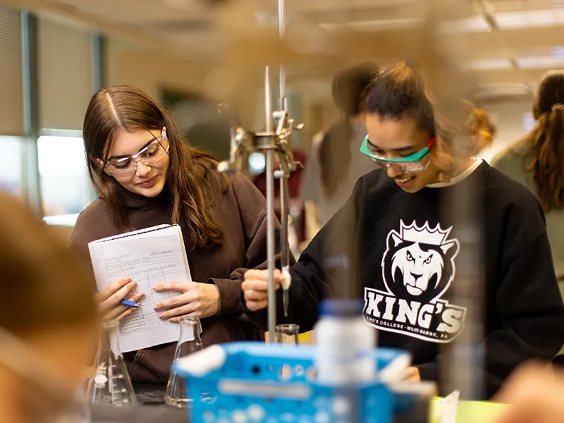 two students wearing protective gear in a lab, one of many health sciences programs at the health sciences college, a staple of the private college experience