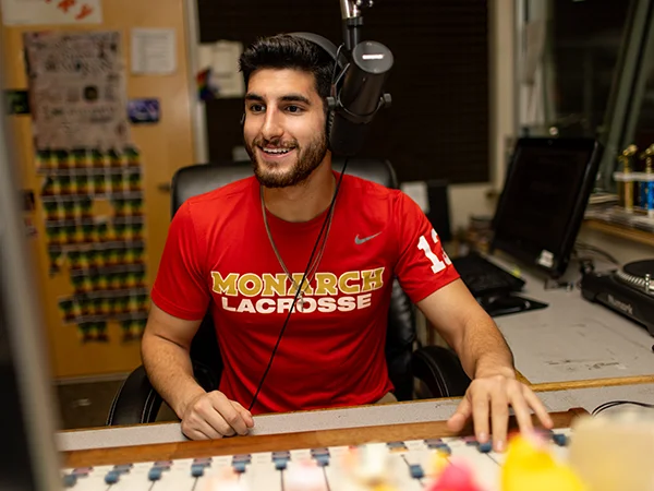 a DJ in the radio studio, one example of what you can do with a communications degree