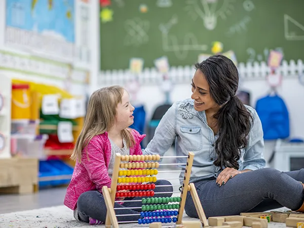 a teacher talking to a special needs students, an example of what you can do with a special education masters