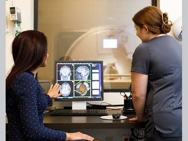 professionals reviewing brain scans, an example of jobs with neuroscience degree